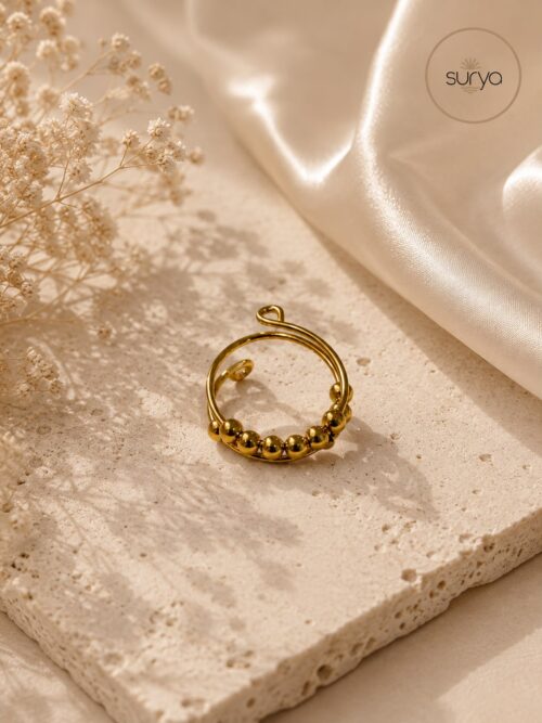 Anillo anti estrés dorado cuentas móviles
